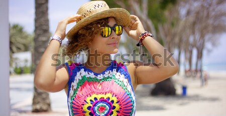 Woman in colorful knit top stretching on balcony Stock photo © dash