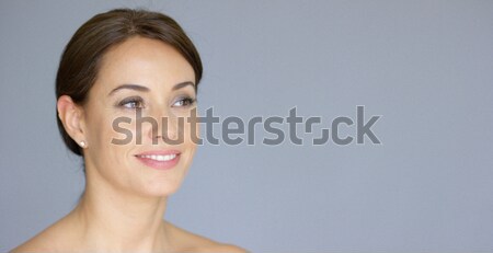 Single gorgeous woman over gray background Stock photo © dash