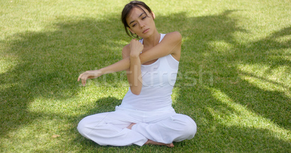 Pretty single woman in empty yard stretching arms Stock photo © dash