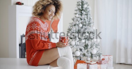 Calm adult in sweater sipping tea while in bed Stock photo © dash