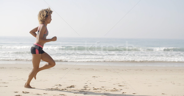Woman Running On The Beach Stock photo © dash
