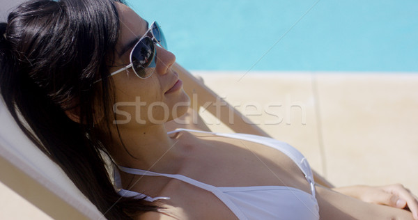 Relaxed woman sunbathing in a deck chair Stock photo © dash