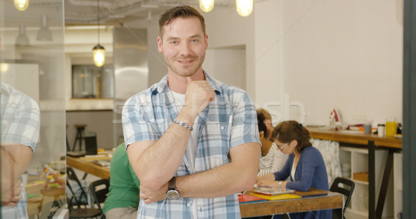 Smiling male employee posing Stock photo © dash