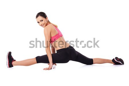 Pretty smiling woman doing the splits Stock photo © dash