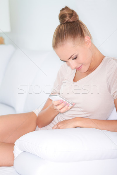 Beautiful woman texting on mobile Stock photo © dash