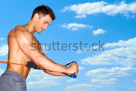 Exercising over sky background Stock photo © dash