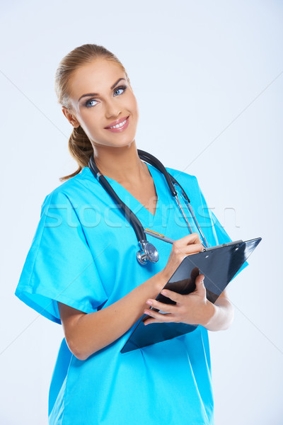 Vriendelijk vrouwelijke arts Blauw permanente Stockfoto © dash