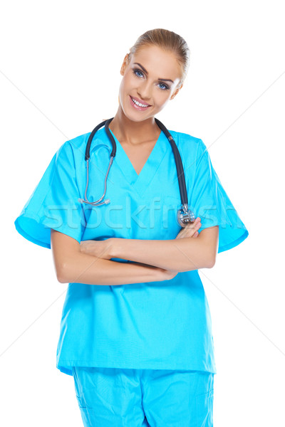 Stock photo: Smiling beautiful doctor in scrubs