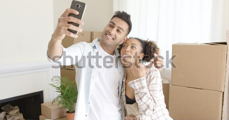 Proud young African American couple with keys Stock photo © dash