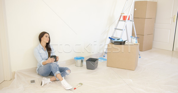 Tired young woman relaxing during renovations Stock photo © dash