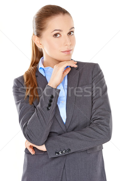 Cético empresária em pé olhando câmera brasão Foto stock © dash