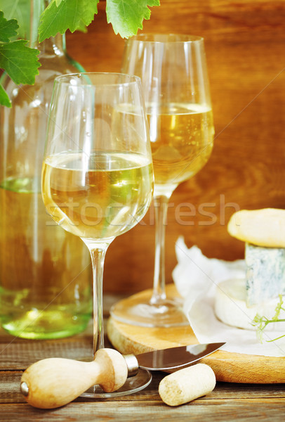 Still life with glasses of white wine and chesse Stock photo © dashapetrenko