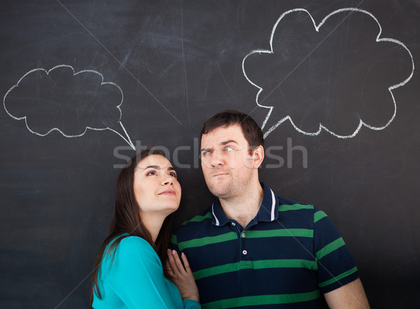 Jovem feliz casal pensando escuro Foto stock © dashapetrenko