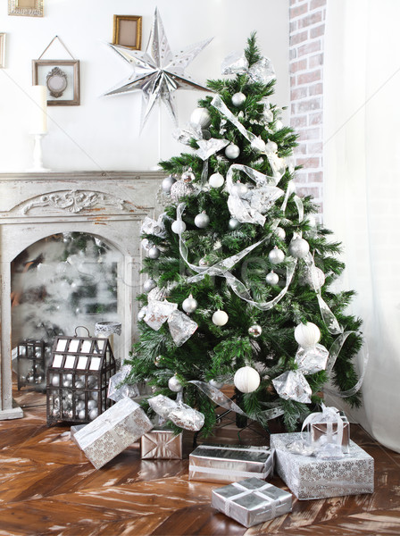 Daily interior decked out with Christmas tree and fireplace Stock photo © dashapetrenko