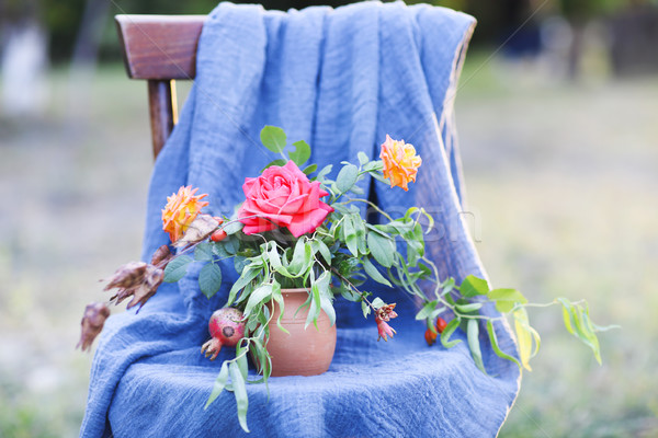 Flower composition on the chair decorated with texstile Stock photo © dashapetrenko