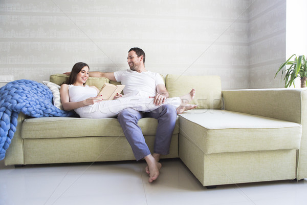Pregnant woman and young man together indoors Stock photo © dashapetrenko