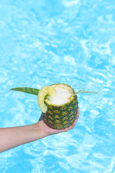  Hand with Pineapple exotic coctail near swimming pool Stock photo © dashapetrenko
