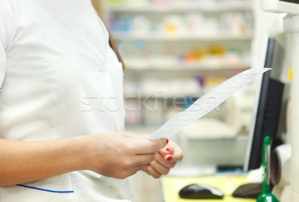 Pharmacist chemist woman with prescription in a drugstore Stock photo © dashapetrenko