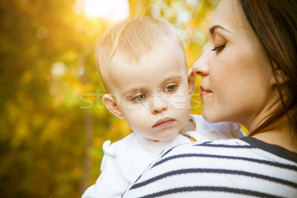 Mother with her baby daughter in autumn park Stock photo © dashapetrenko