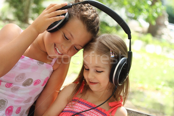 Sisters listen to the music together Stock photo © dashapetrenko