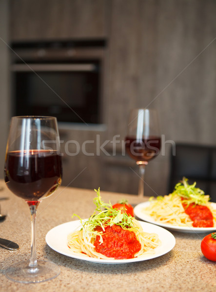 Spaghetti with tomato sauce and red wine in a kitchen Stock photo © dashapetrenko