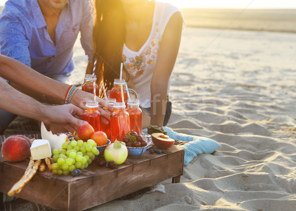 Group of friends holding drinks at the summer picnic Stock photo © dashapetrenko