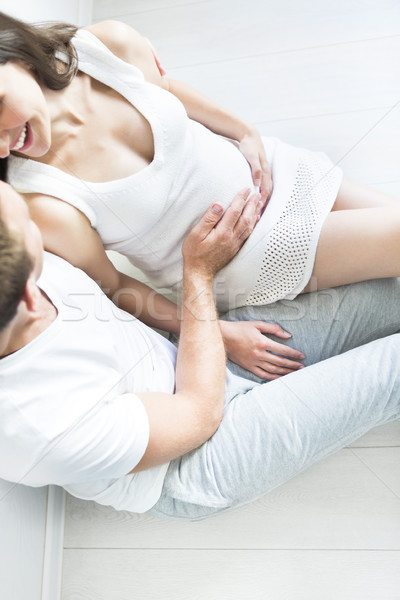 Top view of young man and pretty pregnant woman Stock photo © dashapetrenko