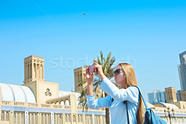 Woman taking mobile photo of the Central Souq in Sharjah City, U Stock photo © dashapetrenko