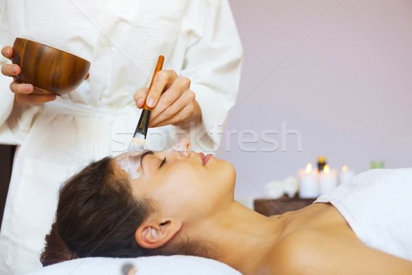 Young beautiful woman in a mask for the face of the therapeutic  Stock photo © dashapetrenko