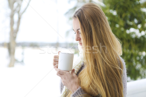 Young beautiful woman with blond hair outdoor with cup Stock photo © dashapetrenko