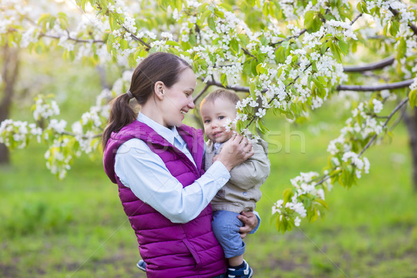 Kicsi baba fiú anya virágzó kert Stock fotó © dashapetrenko