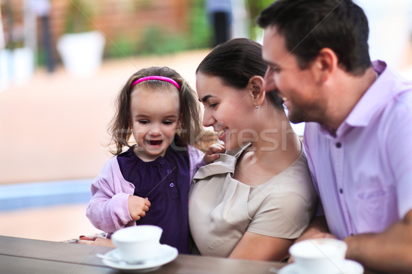 Family enjoying cup of coffee In cafe together Stock photo © dashapetrenko
