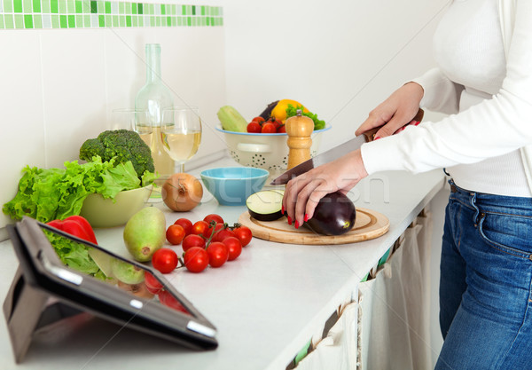 Stock photo: Woman's hands cutting vegetables 
