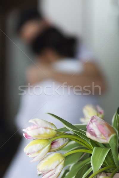 Young couple kisses and hugs at kitchen in the morning Stock photo © dashapetrenko