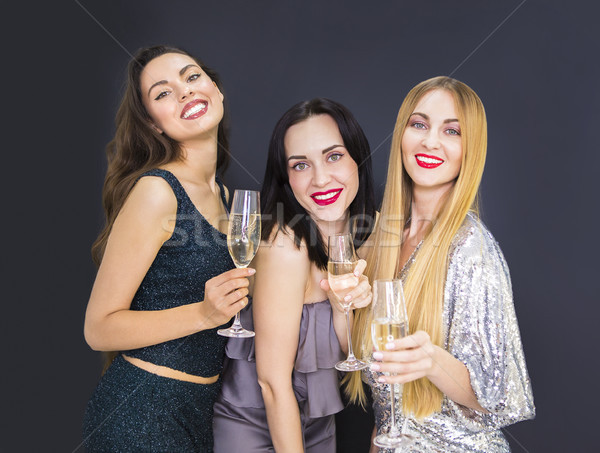 Três mulher jovem champanhe jovem sorrindo Foto stock © dashapetrenko