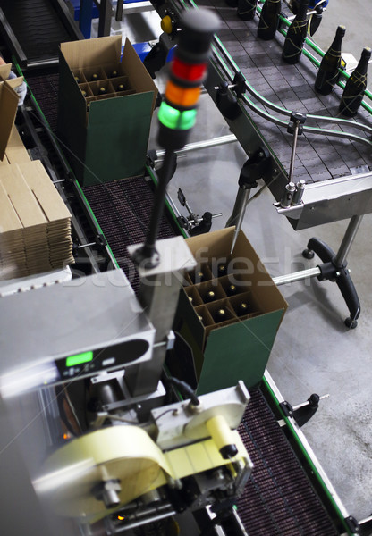 Industrial production shot with champagne bottles on the conveyo Stock photo © dashapetrenko