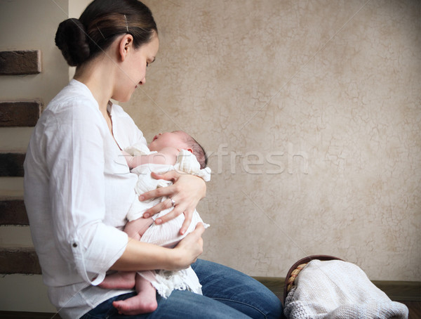 Baby falling asleep in the arms of her mother Stock photo © dashapetrenko