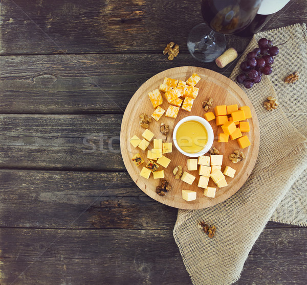 Grape, set of different kind of cheeses with a glass of red wine Stock photo © dashapetrenko