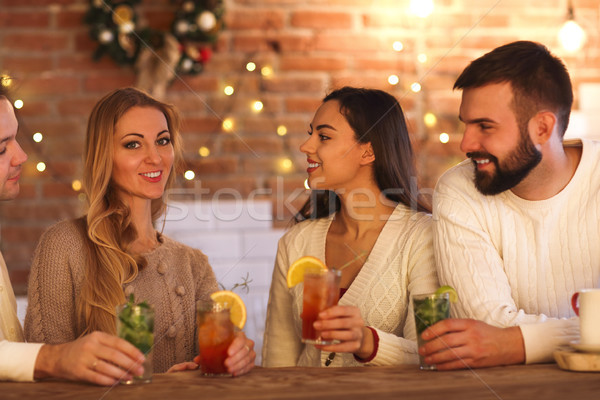 Young men and women drinking cocktail at party Stock photo © dashapetrenko
