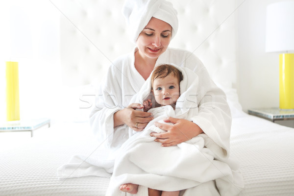 Young woman in the room with baby after bath Stock photo © dashapetrenko