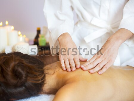Beautiful young woman relaxing with hand massage at beauty spa Stock photo © dashapetrenko