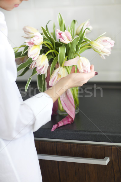 Woman arranging floral bouquet in a kitchen  Stock photo © dashapetrenko