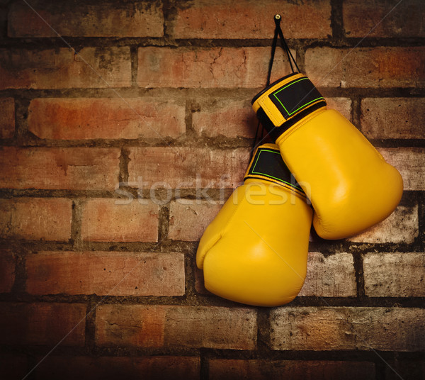 Stock photo: Pair of yellow boxing gloves 