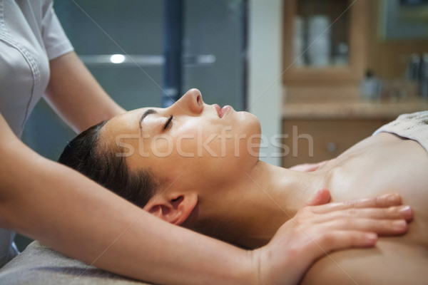 Masseur doing facial massage of the young woman Stock photo © dashapetrenko