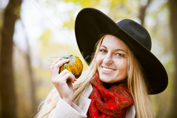 Fashionable blond woman at beautiful autumn alley Stock photo © dashapetrenko