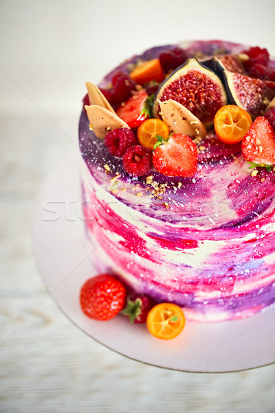 Beautiful bright cake on a porcelain cake stand decorated with f Stock photo © dashapetrenko