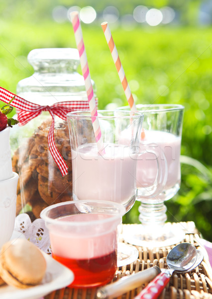 Picnic with strawberry, cookies, strawberry milk, jelly and maca Stock photo © dashapetrenko