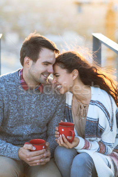 Young man and woman embrace and having fun outdoors Stock photo © dashapetrenko