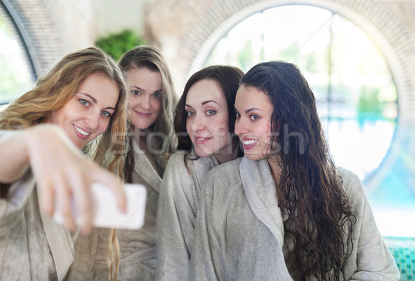 Young women relaxing in the spa resort doing selfy wearing towel Stock photo © dashapetrenko