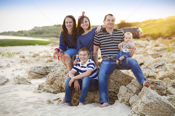 Family of five having fun on the beach Stock photo © dashapetrenko